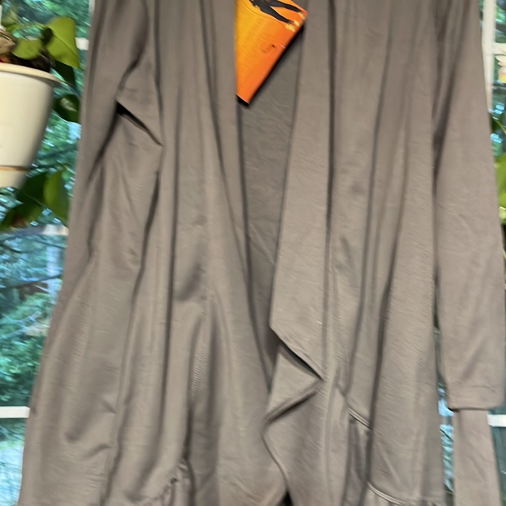 Brand new Serena Williams jacket with pockets and tie belt